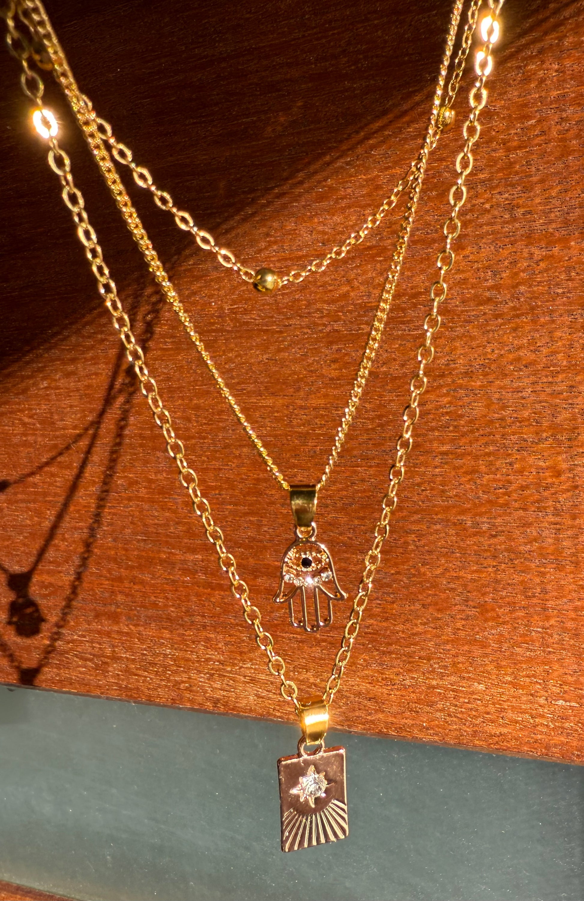 Gold Triple Layer Necklace – Hamsa & Starburst
